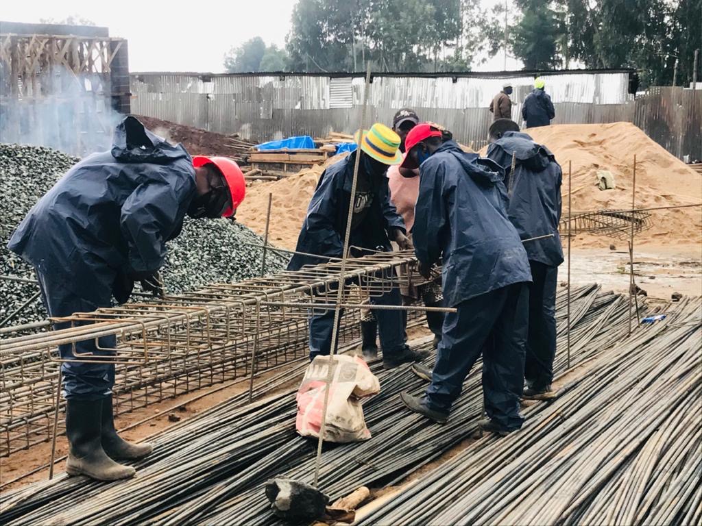 ECEP Ltd workers tying steel rebar on a structural works site