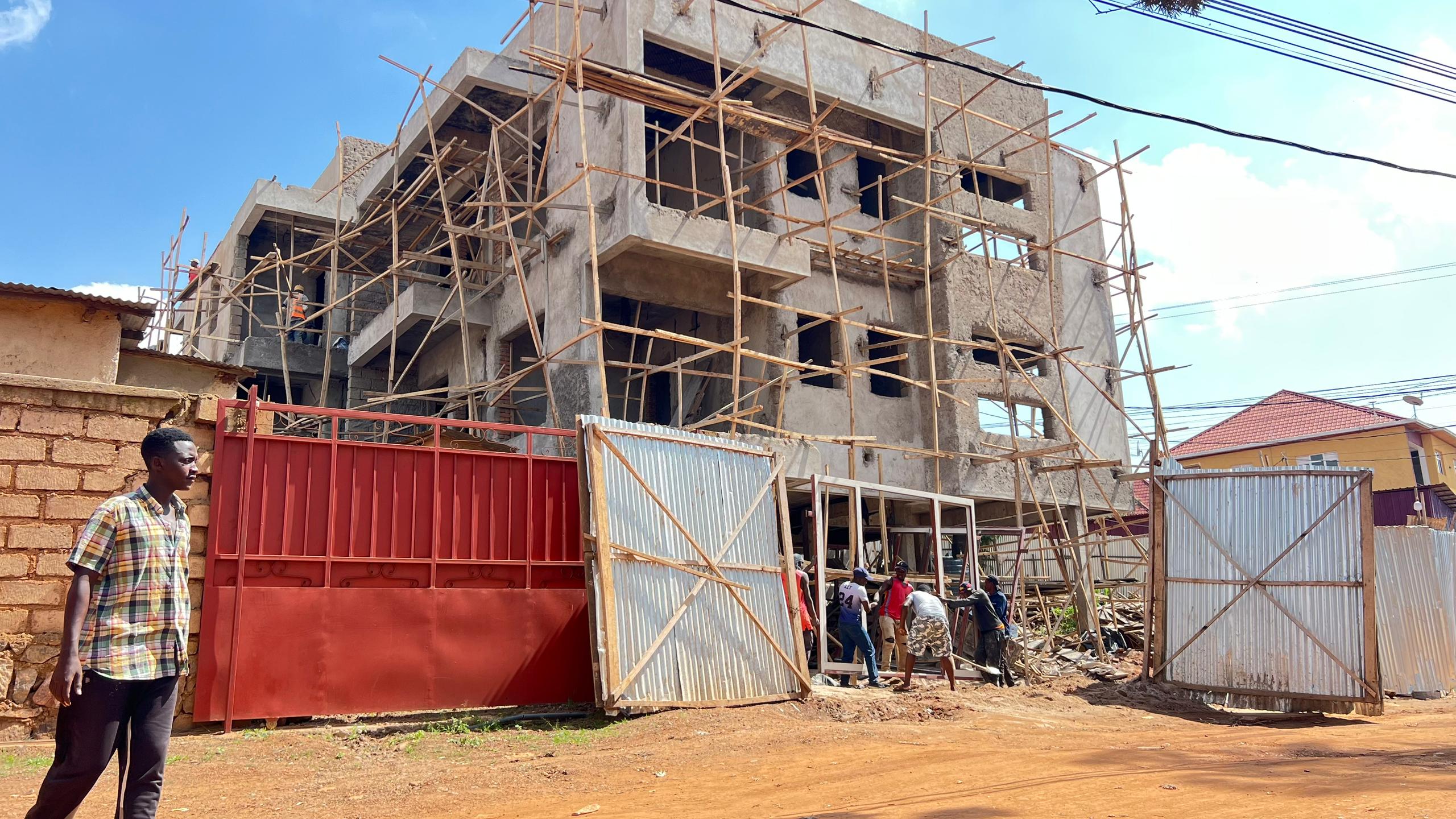 Multi-storey building under construction with bamboo scaffolding, Kigali